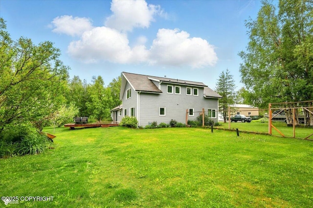 655 N Smith Rd, Palmer, AK 99645 - back of house featuring a wooden deck and a yard