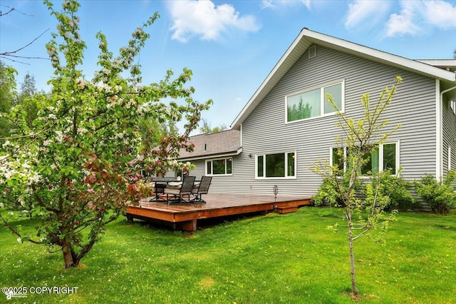 655 N Smith Rd, Palmer, AK 99645 - rear view of house featuring a lawn and a deck