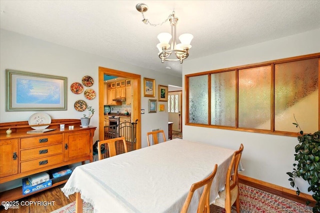 655 N Smith Rd, Palmer, AK 99645 - dining room featuring a chandelier and dark wood finished floors