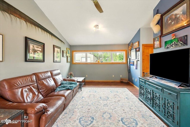 655 N Smith Rd, Palmer, AK 99645 - living area featuring vaulted ceiling, wood finished floors, a ceiling fan, and baseboards