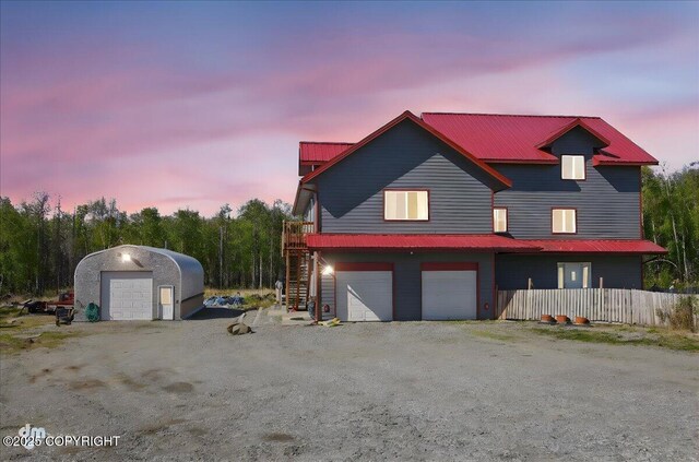 4588 Gold Mint Dr, Wasilla, AK 99654 - view of front of house featuring metal roof, stairs, and a garage