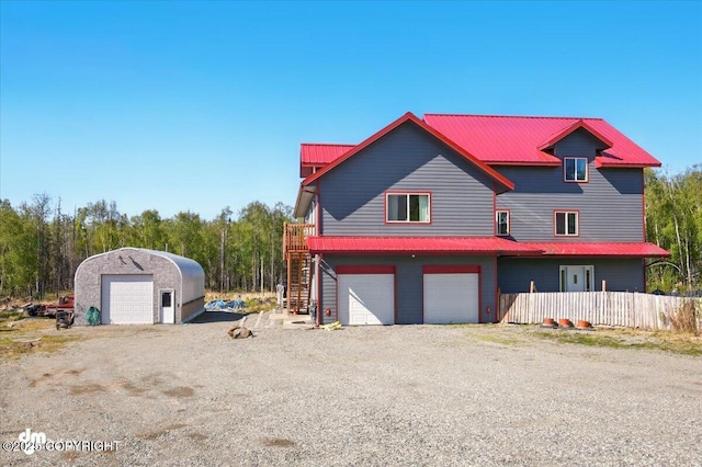 4588 Gold Mint Dr, Wasilla, AK 99654 - view of front of property with stairway, metal roof, and an attached garage