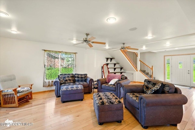 4588 Gold Mint Dr, Wasilla, AK 99654 - living room with stairway, light wood-style floors, and a ceiling fan