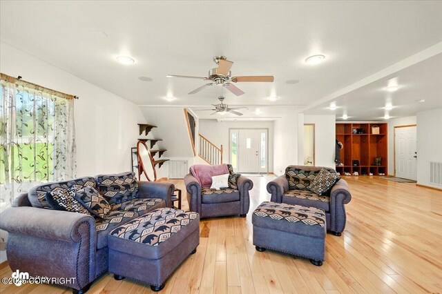 4588 Gold Mint Dr, Wasilla, AK 99654 - living area with stairs, hardwood / wood-style flooring, and a ceiling fan