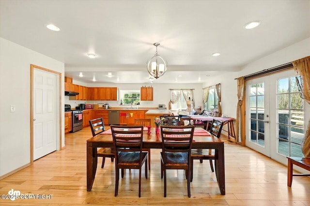 4588 Gold Mint Dr, Wasilla, AK 99654 - dining room featuring french doors, light wood-style flooring, a chandelier, and recessed lighting