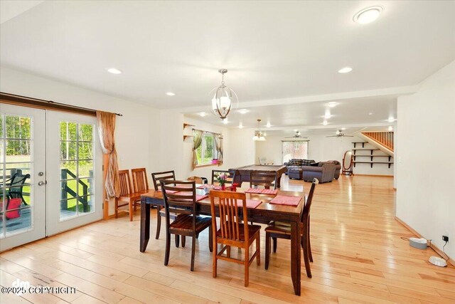 4588 Gold Mint Dr, Wasilla, AK 99654 - dining space featuring plenty of natural light, light wood finished floors, a chandelier, french doors, and recessed lighting