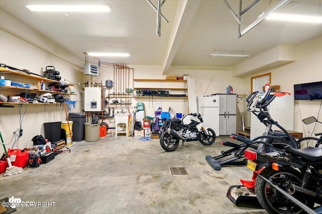 4588 Gold Mint Dr, Wasilla, AK 99654 - garage featuring water heater, a heating unit, and freestanding refrigerator