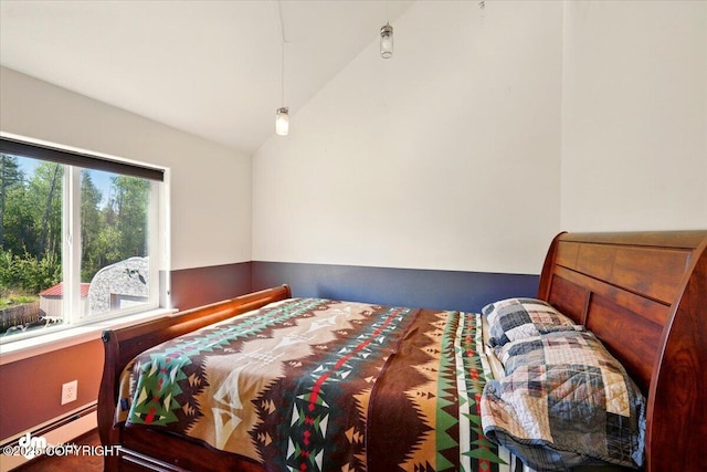 4588 Gold Mint Dr, Wasilla, AK 99654 - bedroom featuring a baseboard heating unit and vaulted ceiling