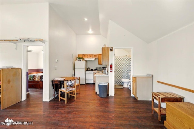 4588 Gold Mint Dr, Wasilla, AK 99654 - kitchen with white appliances, light countertops, dark wood finished floors, high vaulted ceiling, and baseboards