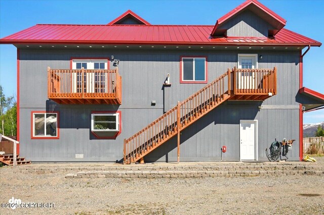 4588 Gold Mint Dr, Wasilla, AK 99654 - rear view of house with metal roof and stairs