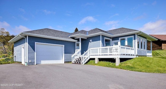 856 Soundview Ave, Homer, AK 99603 - ranch-style home featuring asphalt driveway, a porch, and roof with shingles