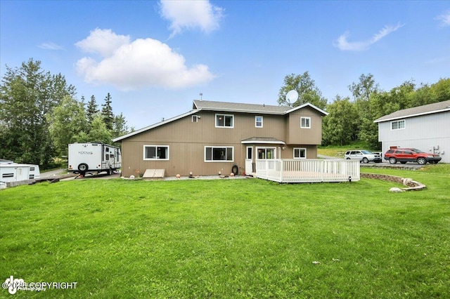 2213 N Tabasco Cat Dr, Palmer, AK 99645 - back of house with a wooden deck and a yard