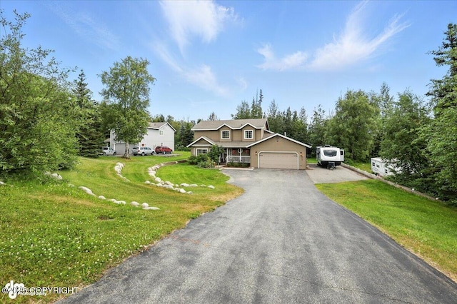 2213 N Tabasco Cat Dr, Palmer, AK 99645 - view of front facade featuring an attached garage, a front yard, and driveway