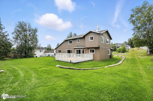 2213 N Tabasco Cat Dr, Palmer, AK 99645 - rear view of property with a wooden deck and a lawn