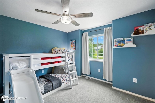 2213 N Tabasco Cat Dr, Palmer, AK 99645 - carpeted bedroom featuring ceiling fan and baseboards