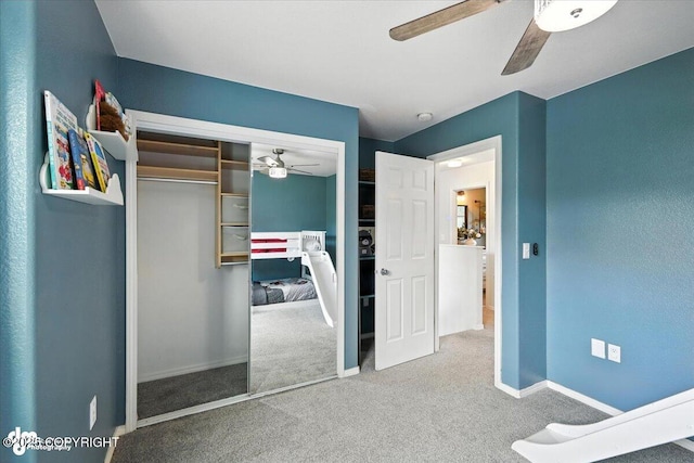 2213 N Tabasco Cat Dr, Palmer, AK 99645 - bedroom with carpet floors, a closet, and a ceiling fan