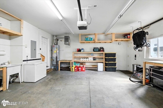 2213 N Tabasco Cat Dr, Palmer, AK 99645 - garage featuring a workshop area, electric panel, water heater, a garage door opener, and fridge