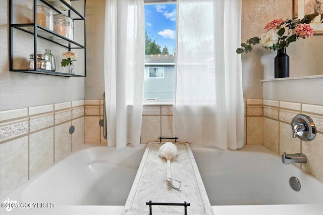 2213 N Tabasco Cat Dr, Palmer, AK 99645 - bathroom featuring a garden tub and a textured wall