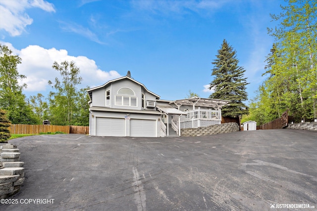 10931 Adanak Cir, Eagle River, AK 99577 - view of front of property featuring driveway, a garage, and stairs
