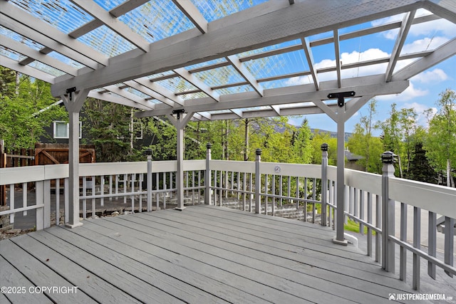 10931 Adanak Cir, Eagle River, AK 99577 - deck with a pergola and view of wooded area