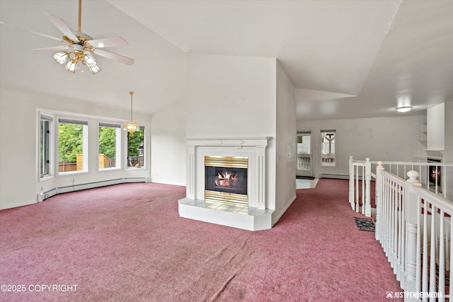 10931 Adanak Cir, Eagle River, AK 99577 - unfurnished living room with baseboard heating, lofted ceiling, carpet floors, and healthy amount of natural light