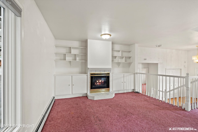 10931 Adanak Cir, Eagle River, AK 99577 - unfurnished living room with carpet, a fireplace, a chandelier, and a baseboard heating unit