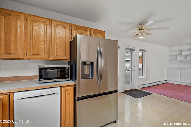 10931 Adanak Cir, Eagle River, AK 99577 - kitchen featuring stainless steel appliances, a baseboard radiator, a ceiling fan, light countertops, and open floor plan