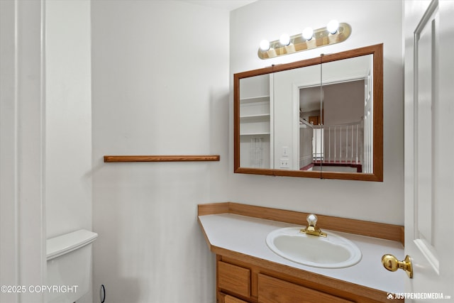 10931 Adanak Cir, Eagle River, AK 99577 - half bathroom featuring toilet and vanity