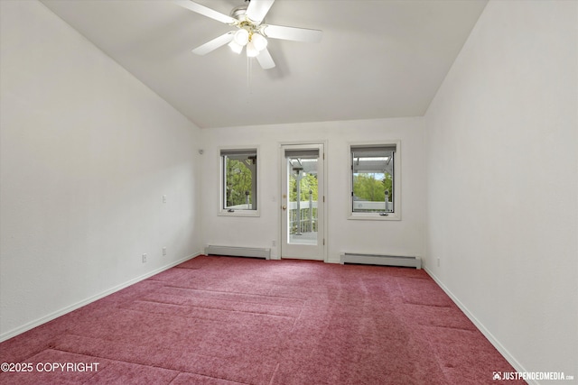 10931 Adanak Cir, Eagle River, AK 99577 - empty room featuring a baseboard heating unit, vaulted ceiling, carpet, ceiling fan, and baseboards
