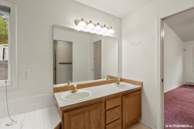 10931 Adanak Cir, Eagle River, AK 99577 - full bath with double vanity, a baseboard heating unit, and tile patterned floors