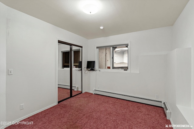 10931 Adanak Cir, Eagle River, AK 99577 - unfurnished bedroom with a baseboard heating unit, carpet floors, and baseboards