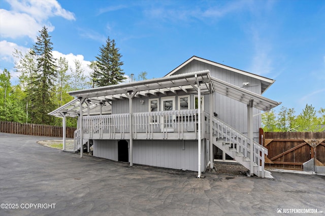 10931 Adanak Cir, Eagle River, AK 99577 - view of front of home featuring stairway and a wooden deck