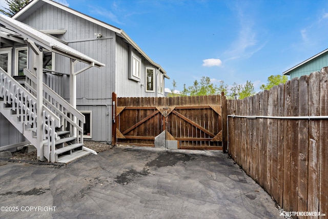 10931 Adanak Cir, Eagle River, AK 99577 - view of patio / terrace featuring stairs and a gate