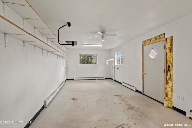 10931 Adanak Cir, Eagle River, AK 99577 - garage featuring a baseboard radiator, a baseboard heating unit, and a ceiling fan