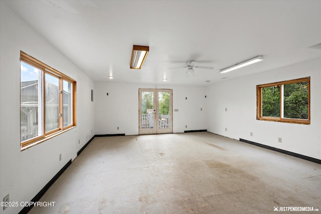 10931 Adanak Cir, Eagle River, AK 99577 - unfurnished room featuring healthy amount of natural light, french doors, baseboards, and ceiling fan
