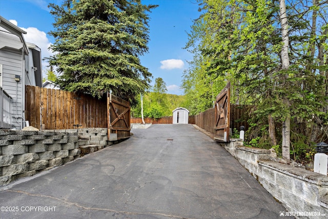 10931 Adanak Cir, Eagle River, AK 99577 - view of asphalt driveway