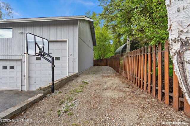 10931 Adanak Cir, Eagle River, AK 99577 - view of home's exterior featuring a garage