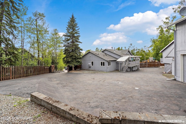 10931 Adanak Cir, Eagle River, AK 99577 - rear view of property with a deck and stairs