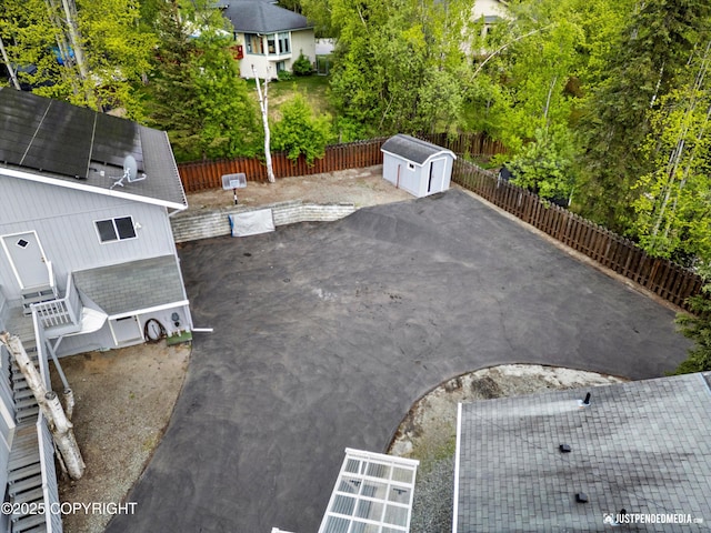 10931 Adanak Cir, Eagle River, AK 99577 - fenced backyard featuring a patio area