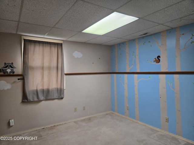 17690 E Idle Dr, Palmer, AK 99645 - unfurnished room featuring a drop ceiling, baseboards, and carpet floors