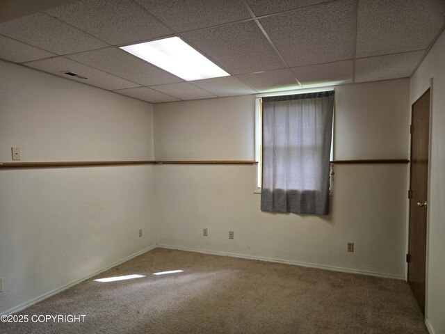 17690 E Idle Dr, Palmer, AK 99645 - unfurnished room with a paneled ceiling, carpet, and baseboards