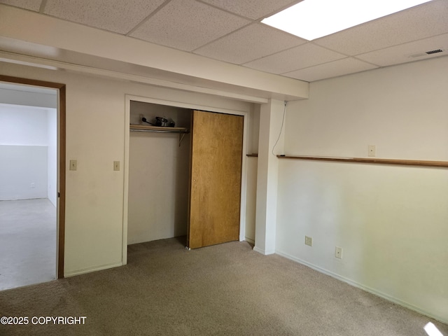 17690 E Idle Dr, Palmer, AK 99645 - unfurnished bedroom with carpet flooring, a paneled ceiling, and a closet