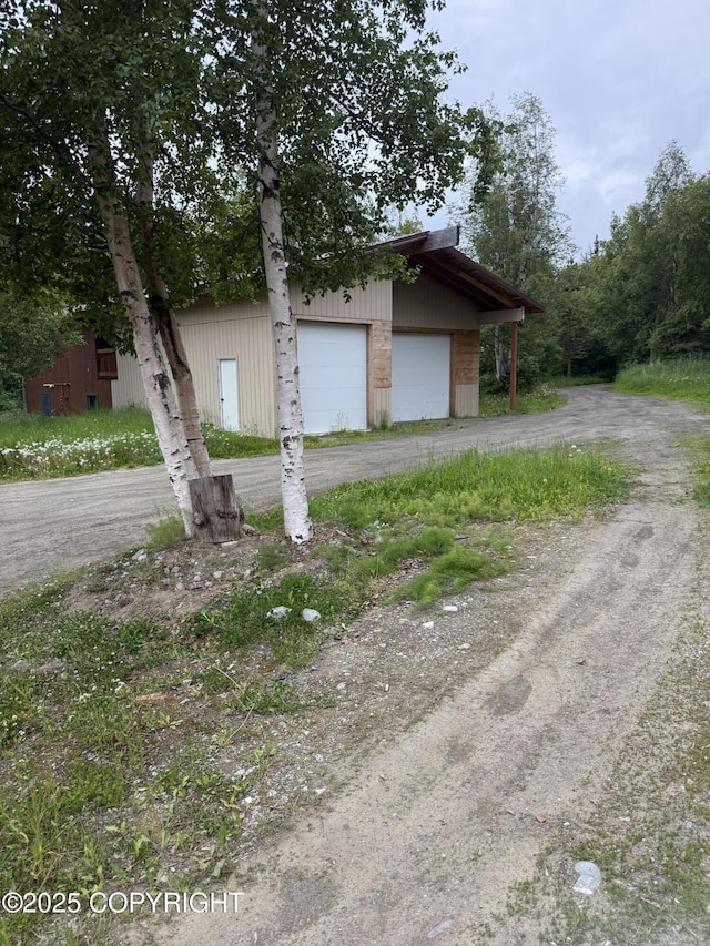 17690 E Idle Dr, Palmer, AK 99645 - view of front of property with an outbuilding and dirt driveway