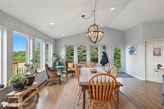 41722 Charlie Dr, Homer, AK 99603 - dining space featuring wood finished floors, lofted ceiling, a chandelier, and recessed lighting