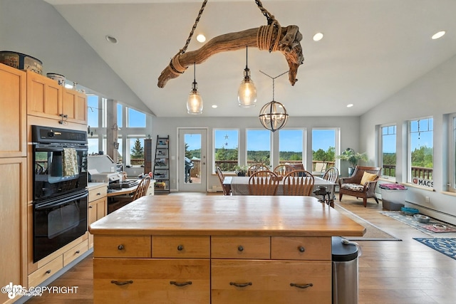 41722 Charlie Dr, Homer, AK 99603 - kitchen featuring wooden counters, wood finished floors, recessed lighting, pendant lighting, and high vaulted ceiling