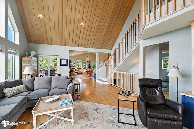 41722 Charlie Dr, Homer, AK 99603 - living area featuring high vaulted ceiling, wood finished floors, recessed lighting, and stairway
