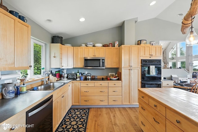 41722 Charlie Dr, Homer, AK 99603 - kitchen with dishwashing machine, light brown cabinetry, lofted ceiling, stainless steel microwave, and light wood finished floors