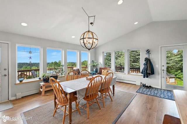 41722 Charlie Dr, Homer, AK 99603 - dining room with a chandelier, vaulted ceiling, recessed lighting, light wood-type flooring, and a baseboard heating unit