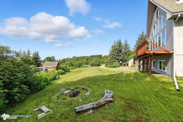 41722 Charlie Dr, Homer, AK 99603 - view of green lawn featuring a deck