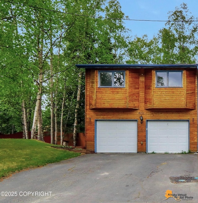 18739 Sarichef Loop, Eagle River, AK 99577 - view of front of house featuring a garage, driveway, and a front yard